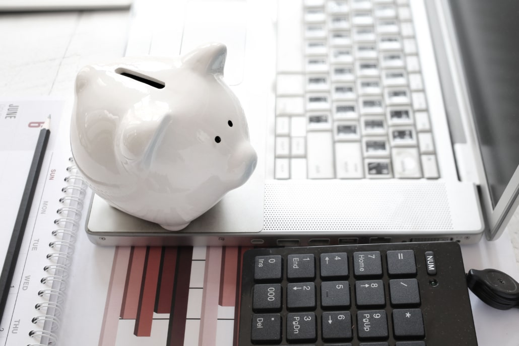 Save money laptop and piggy bank