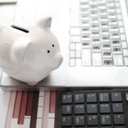 Save money laptop and piggy bank