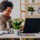 working business woman with a computer and plants