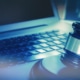 This image shows a gavel and a laptop as cybersecurity is important for law firms.