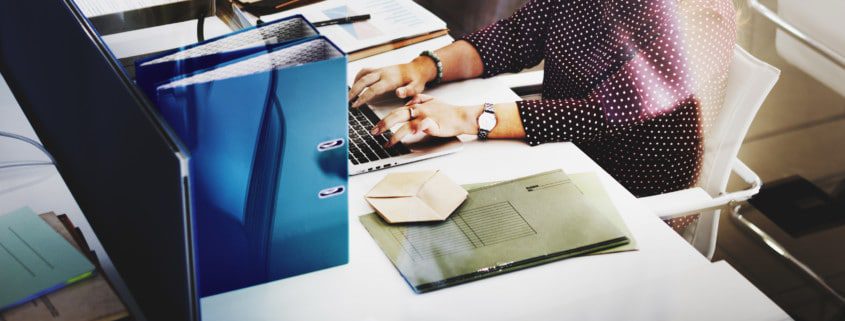women at computer desk